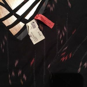 Quarter sleeve length dressy top. Never been worn.